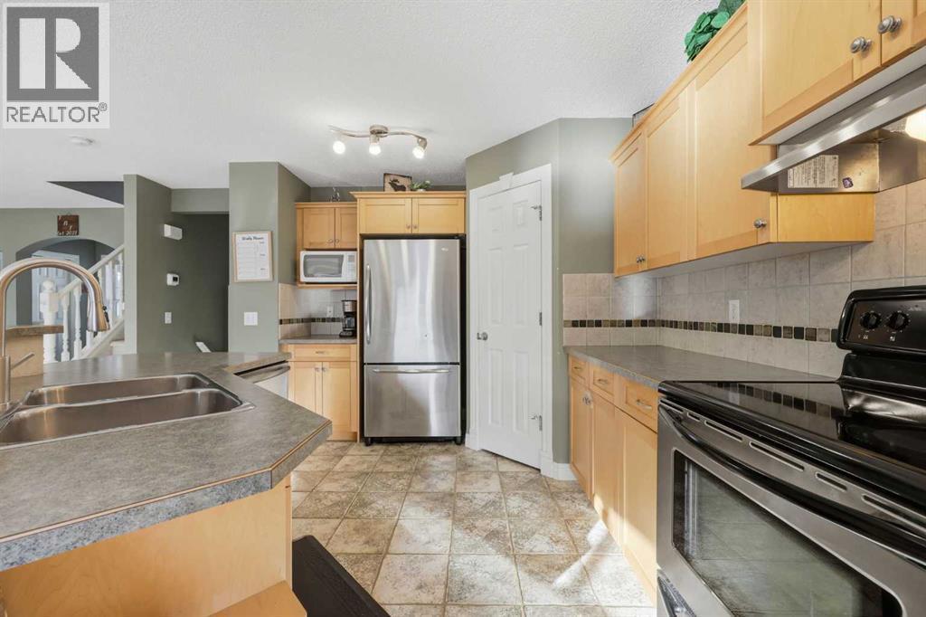 291 Springmere Link Sw, Chestermere, AB - Indoor Photo Showing Kitchen With Double Sink