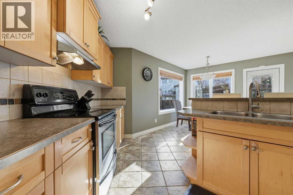 291 Springmere Link Sw, Chestermere, AB - Indoor Photo Showing Kitchen With Double Sink