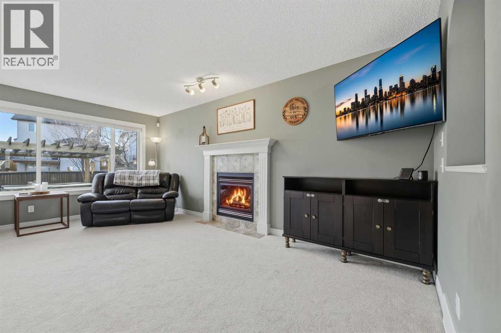 291 Springmere Link Sw, Chestermere, AB - Indoor With Fireplace
