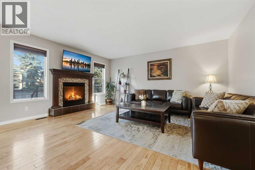 307 Valley Crest Court Nw, Calgary, AB - Indoor Photo Showing Living Room With Fireplace