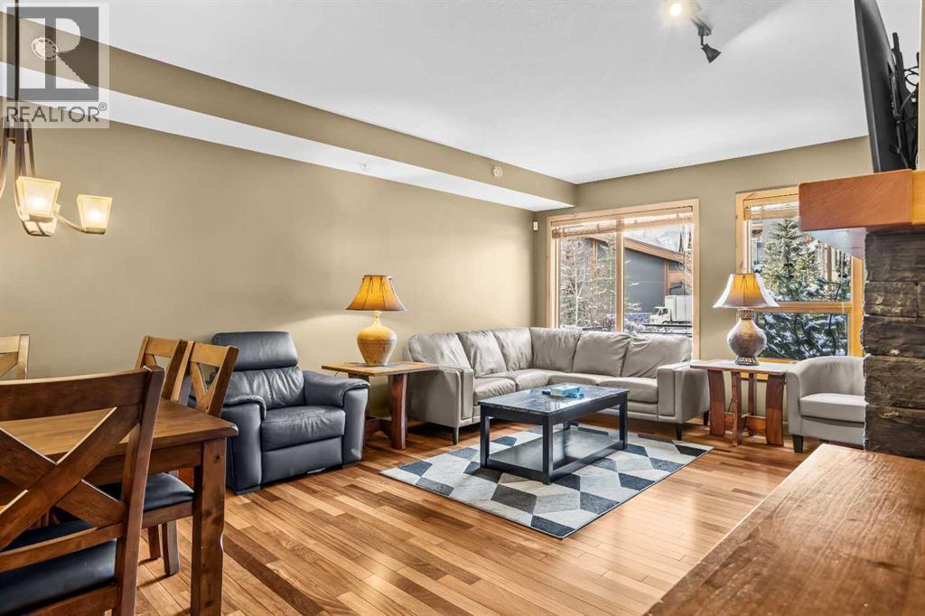 112, 379 Spring Creek Drive, Canmore, AB - Indoor Photo Showing Living Room