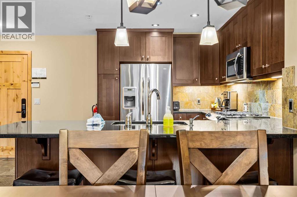 112, 379 Spring Creek Drive, Canmore, AB - Indoor Photo Showing Kitchen With Upgraded Kitchen