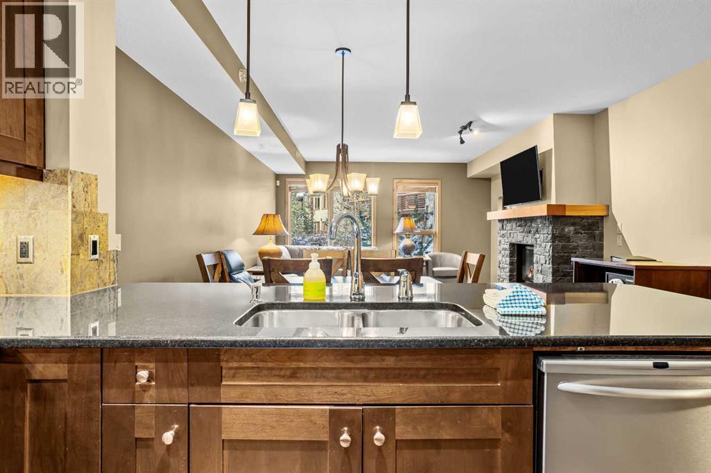 112, 379 Spring Creek Drive, Canmore, AB - Indoor Photo Showing Kitchen With Double Sink