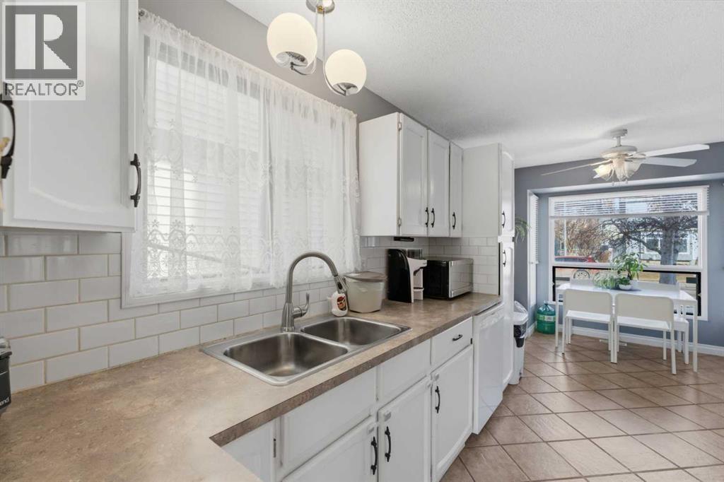 96 Abberfield Crescent Ne, Calgary, AB - Indoor Photo Showing Kitchen With Double Sink