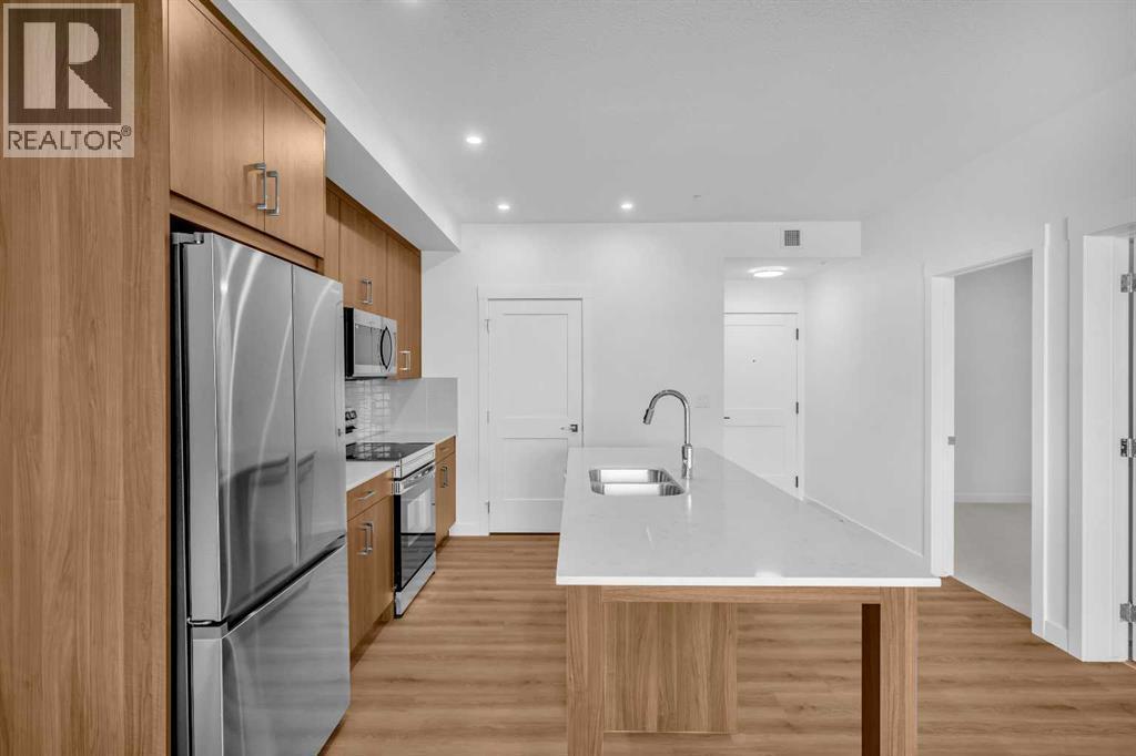 7209, 1802 Mahogany Boulevard, Calgary, AB - Indoor Photo Showing Kitchen With Double Sink With Upgraded Kitchen