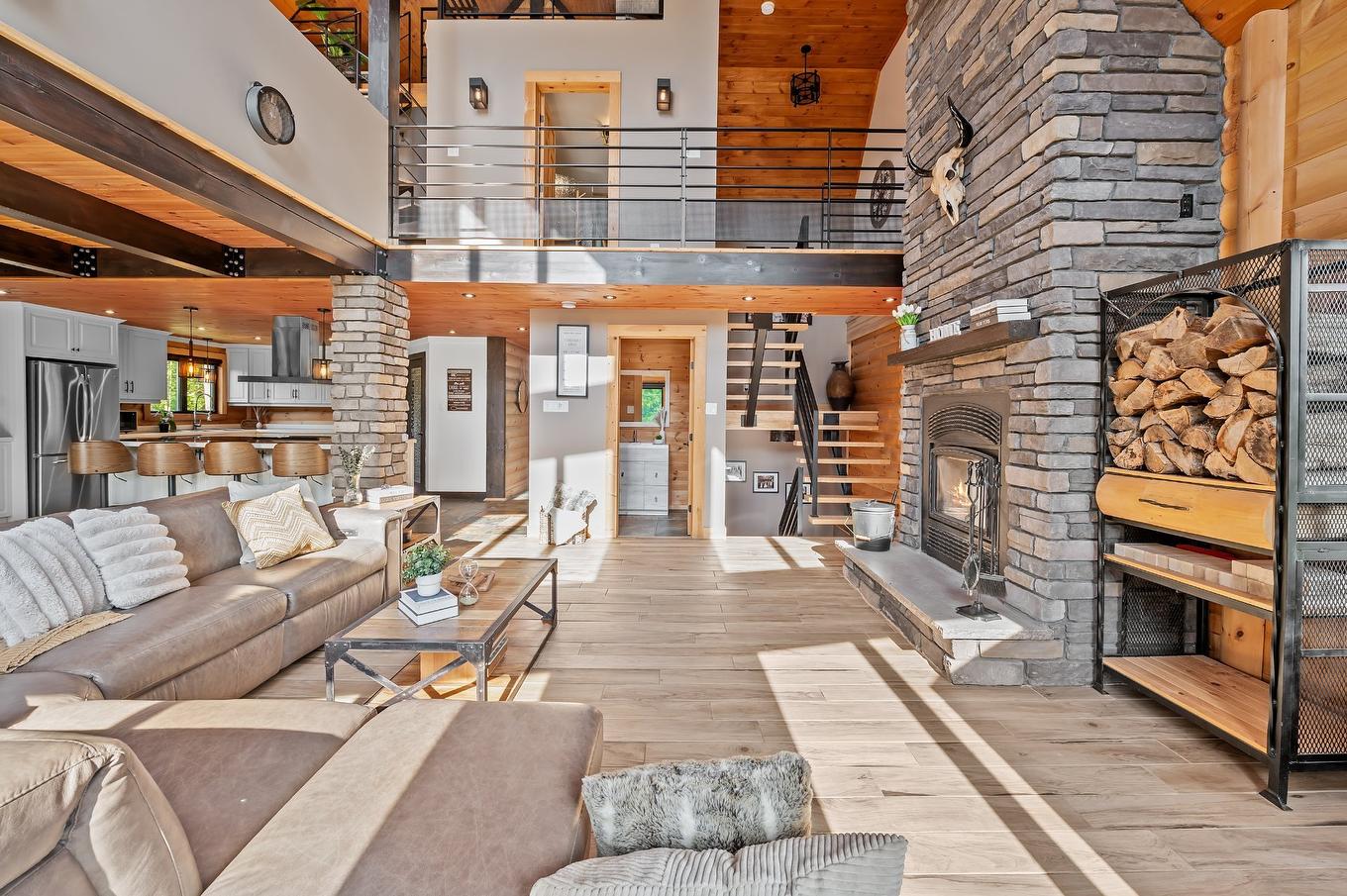 Vue d'ensemble - 55 Rue Du Soleil, Saint-Hippolyte, QC - Indoor Photo Showing Living Room With Fireplace