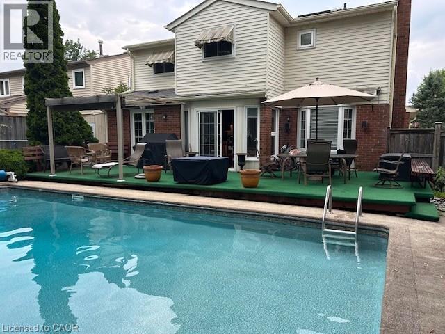 21 Sandcliffe Place, Waterloo, ON - Outdoor With In Ground Pool With Deck Patio Veranda
