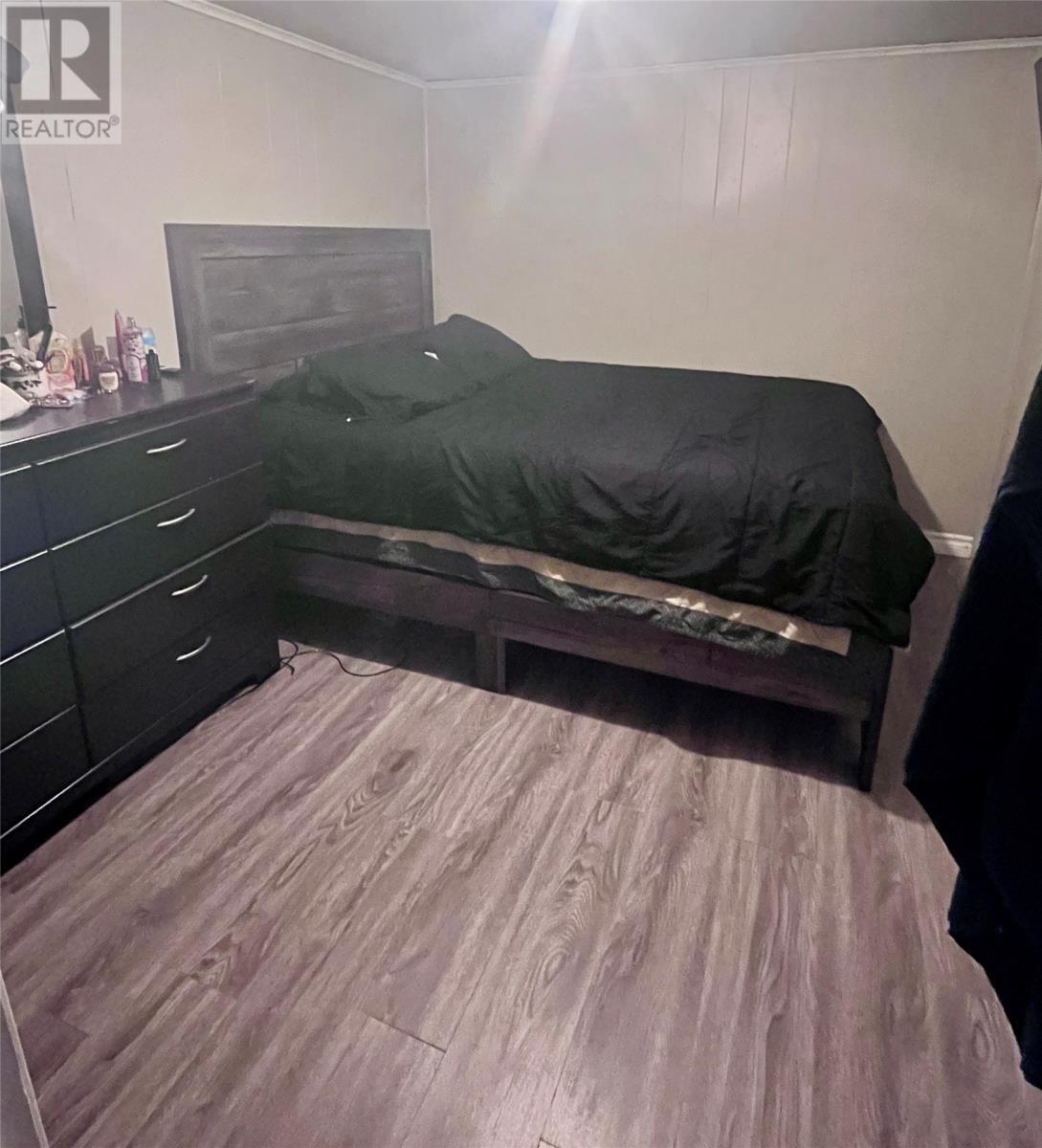 Apartment Primary Bedroom - 1 Windsor Place, Grand Falls-Windsor, NL - Indoor Photo Showing Bedroom