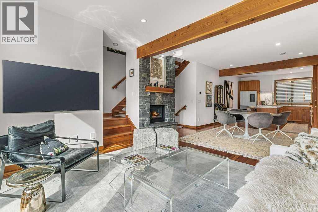 4, 511 6Th Avenue, Canmore, AB - Indoor Photo Showing Living Room With Fireplace