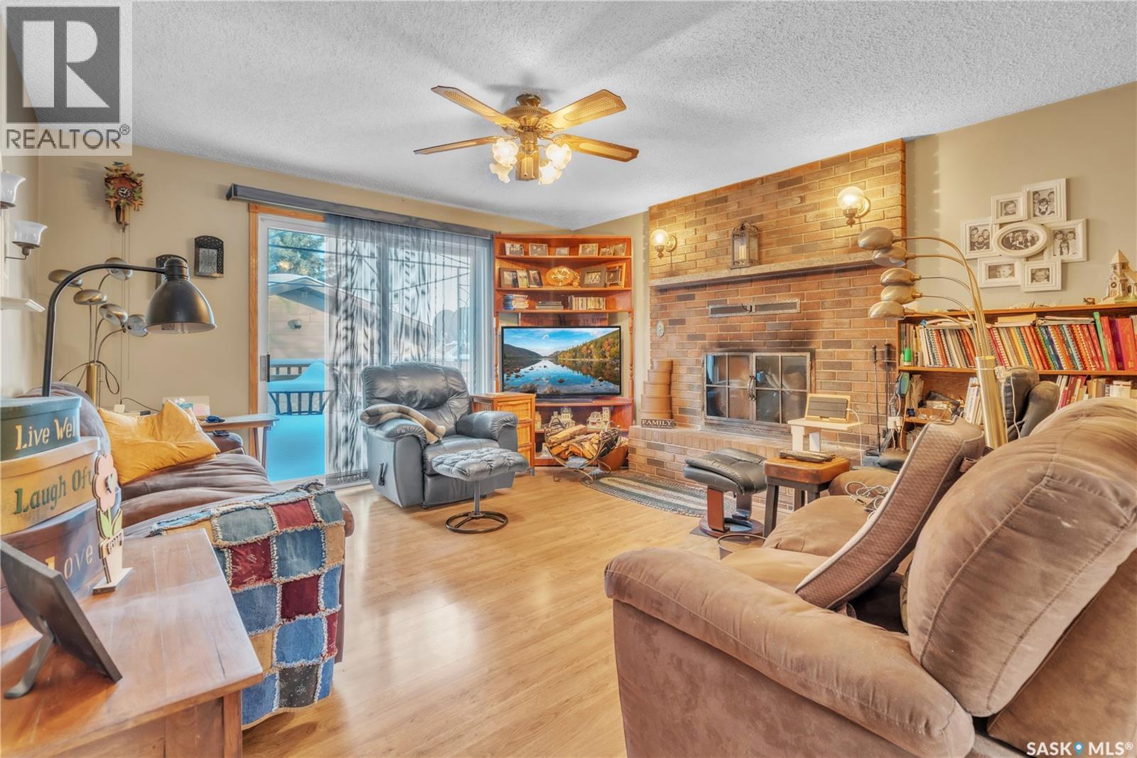 178 4Th Street E, Pierceland, SK - Indoor Photo Showing Other Room With Fireplace