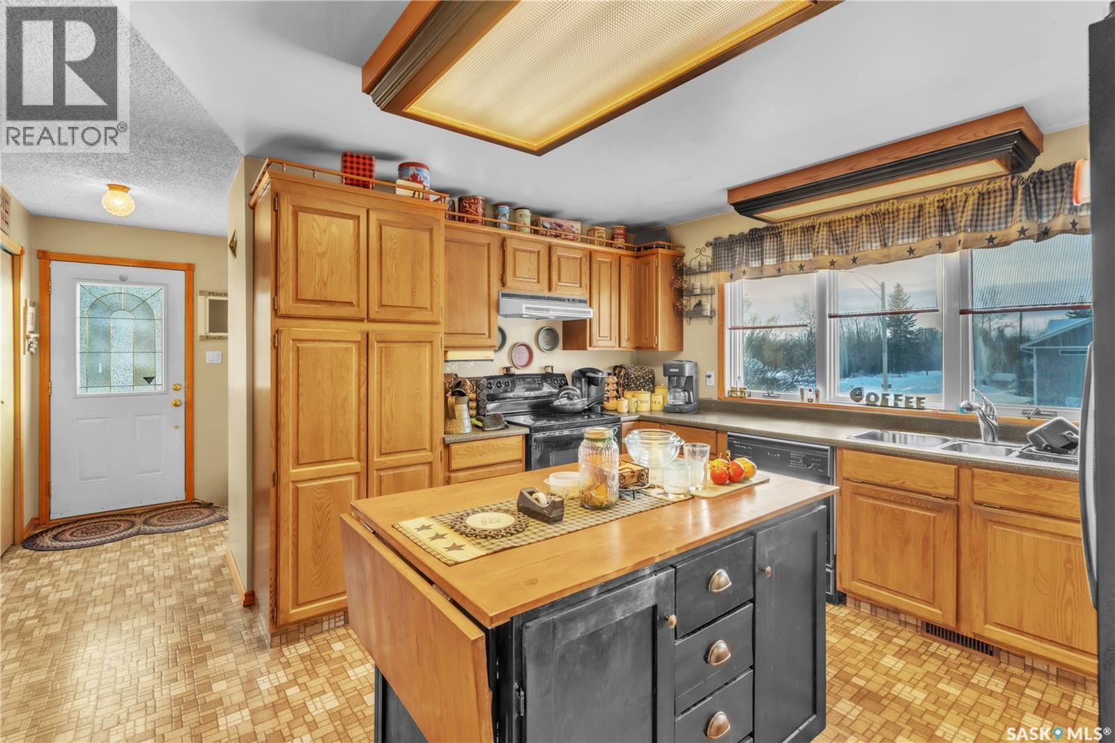 178 4Th Street E, Pierceland, SK - Indoor Photo Showing Kitchen With Double Sink