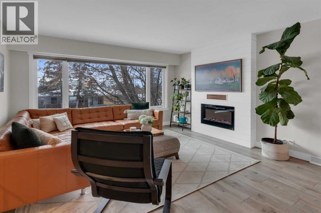 184 Cornwallis Drive Nw, Calgary, AB - Indoor Photo Showing Living Room With Fireplace