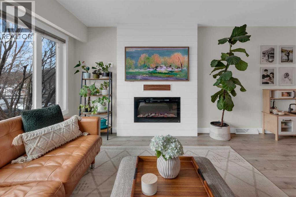 184 Cornwallis Drive Nw, Calgary, AB - Indoor Photo Showing Living Room With Fireplace