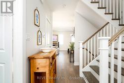 The hall draws you to the modern main living area. -