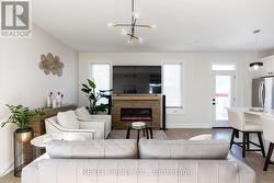 The sideboard mounts above the fireplace for a TV. -