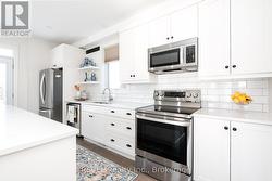 The stainless steel appliances are included. -