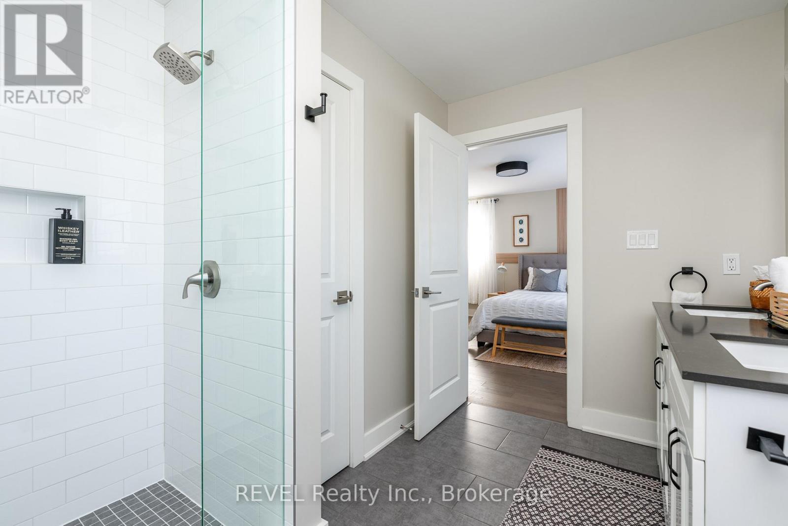 It features a stylish walk-in shower. - 1 Princeton Common Street, St. Catharines (Lakeport), ON