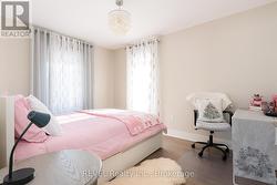 The bright front third bedroom. -