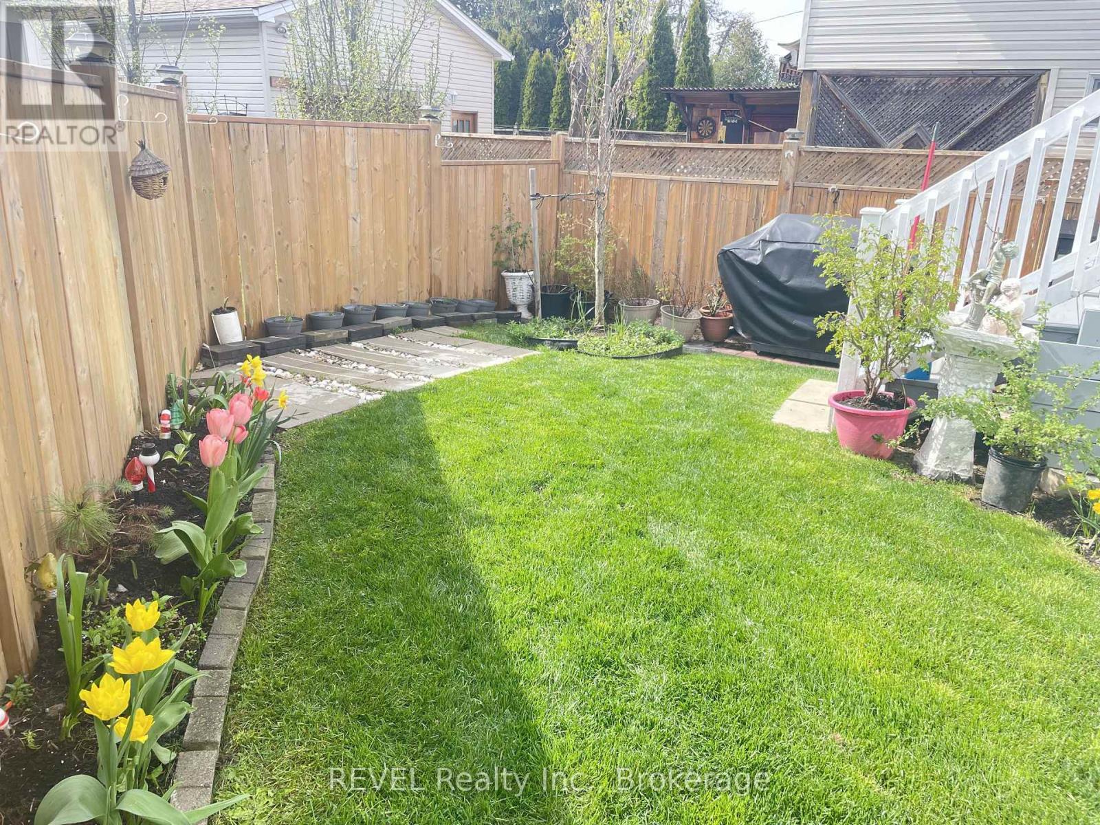 The fully fenced backyard space. - 1 Princeton Common Street, St. Catharines (Lakeport), ON