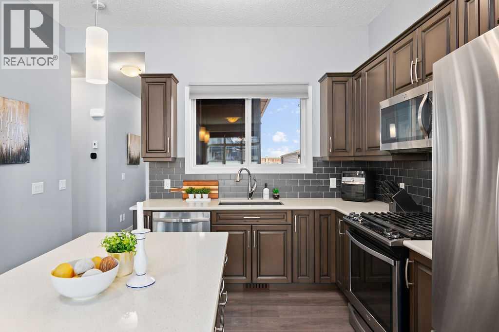 Quartz counters - 103 Masters Heights Se, Calgary, AB - Indoor Photo Showing Other Room