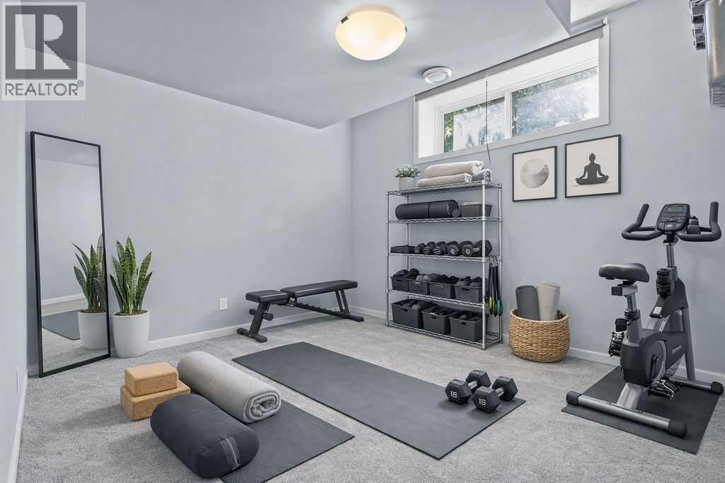 2nd basement bedroom with walk-in closet - 103 Masters Heights Se, Calgary, AB - Indoor Photo Showing Gym Room