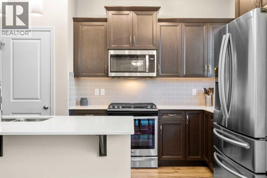 50 Legacy Glen Common Se, Calgary, AB - Indoor Photo Showing Kitchen With Double Sink With Upgraded Kitchen