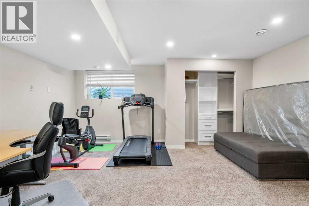 50 Legacy Glen Common Se, Calgary, AB - Indoor Photo Showing Gym Room