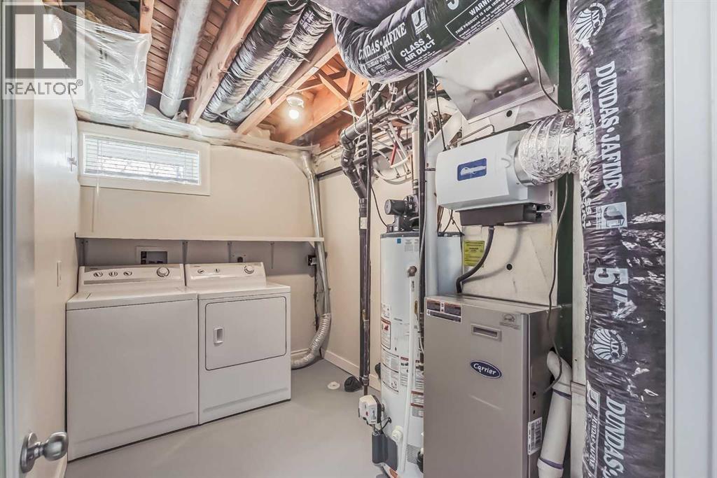 23 Cheltenham Road Nw, Calgary, AB - Indoor Photo Showing Laundry Room