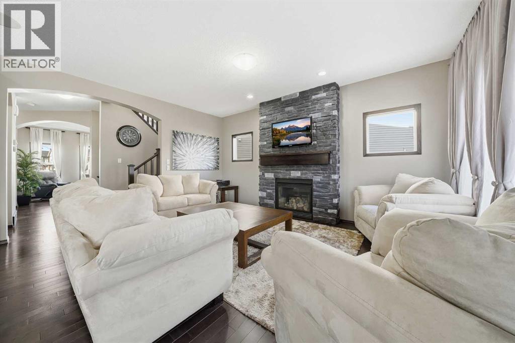 65 Elgin Meadows Circle Se, Calgary, AB - Indoor Photo Showing Living Room With Fireplace