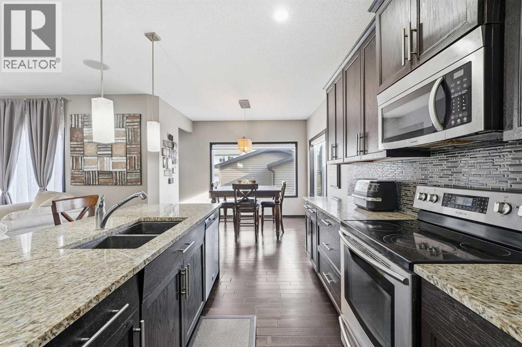 65 Elgin Meadows Circle Se, Calgary, AB - Indoor Photo Showing Kitchen With Stainless Steel Kitchen With Double Sink With Upgraded Kitchen