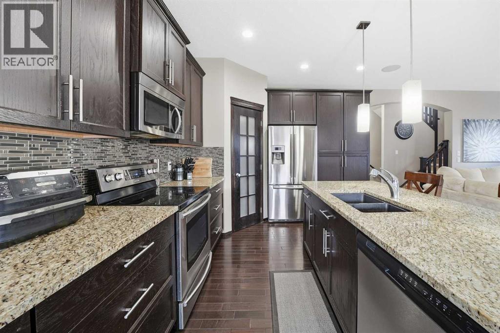 65 Elgin Meadows Circle Se, Calgary, AB - Indoor Photo Showing Kitchen With Stainless Steel Kitchen With Double Sink With Upgraded Kitchen