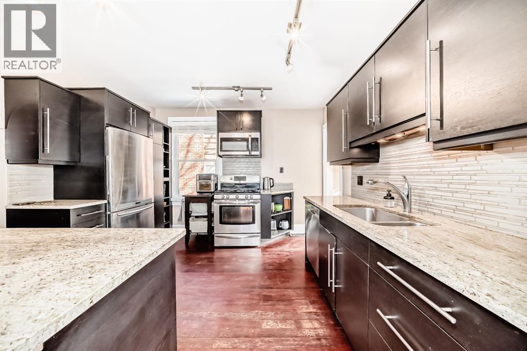 2125 36 Avenue Sw, Calgary, AB - Indoor Photo Showing Kitchen With Double Sink With Upgraded Kitchen