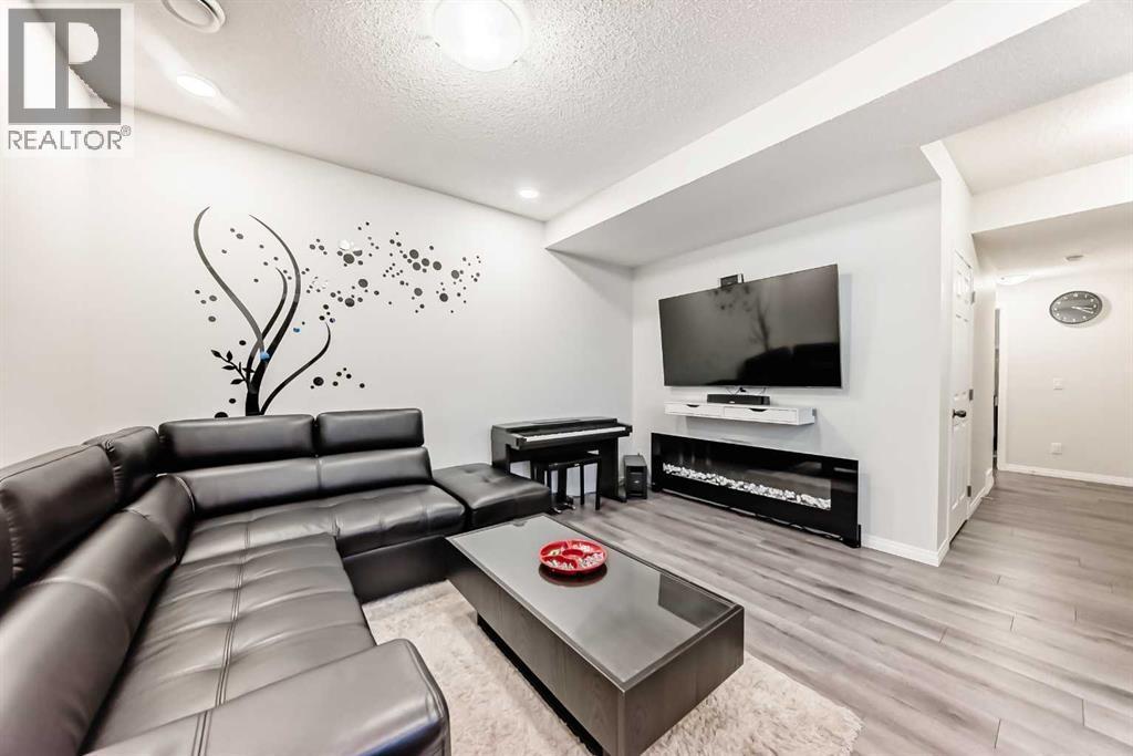 217 Masters Road Se, Calgary, AB - Indoor Photo Showing Living Room With Fireplace