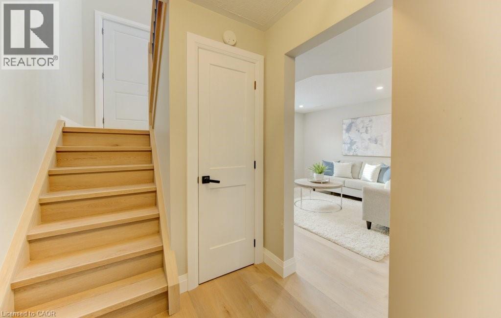 stairs to rec room and garage - 402 Heritage Drive, Kitchener, ON - Indoor Photo Showing Other Room