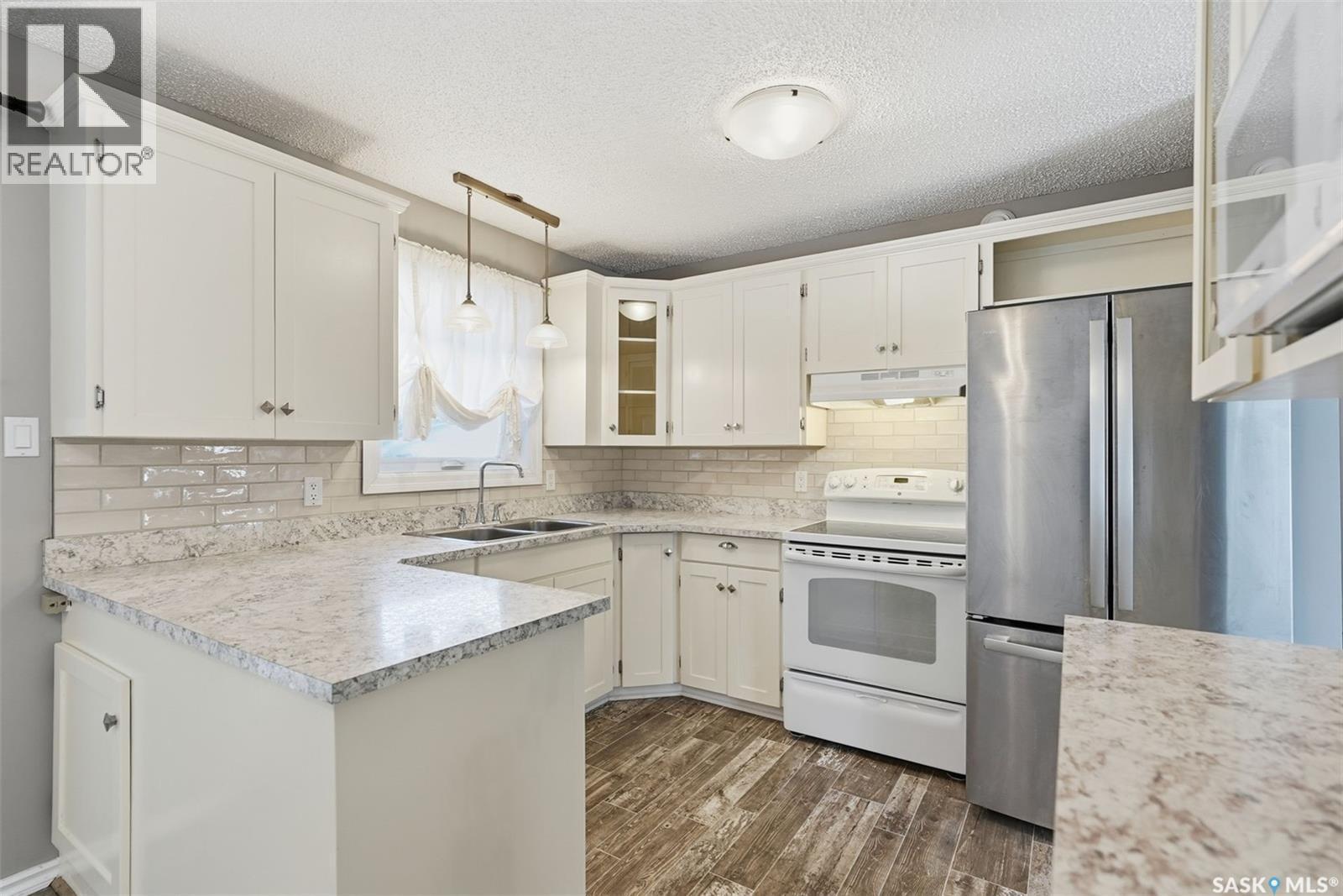 3441 12Th Avenue E, Prince Albert, SK - Indoor Photo Showing Kitchen With Double Sink