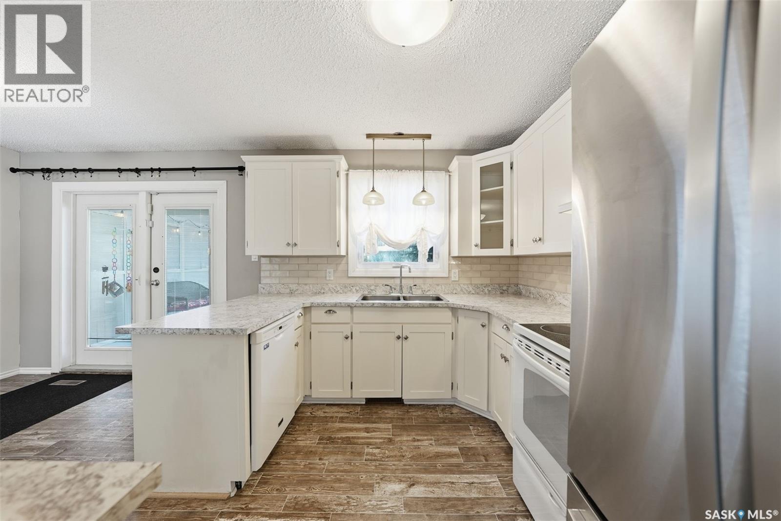 3441 12Th Avenue E, Prince Albert, SK - Indoor Photo Showing Kitchen With Double Sink
