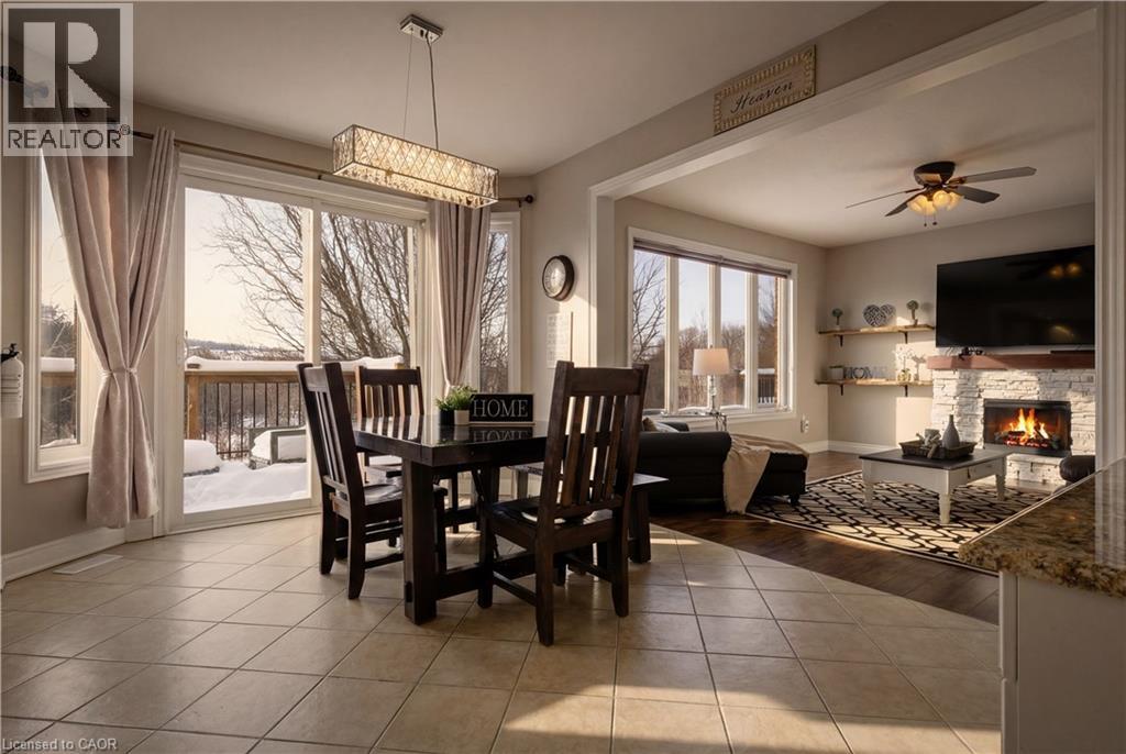 Virtually staged - 75 Chase Crescent, Cambridge, ON - Indoor Photo Showing Dining Room With Fireplace