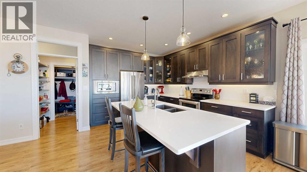 4020 Monarch Way, Stettler, AB - Indoor Photo Showing Kitchen With Stainless Steel Kitchen With Double Sink With Upgraded Kitchen