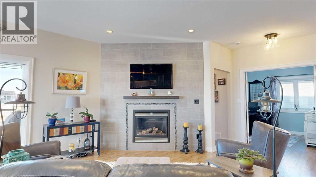 4020 Monarch Way, Stettler, AB - Indoor Photo Showing Living Room With Fireplace
