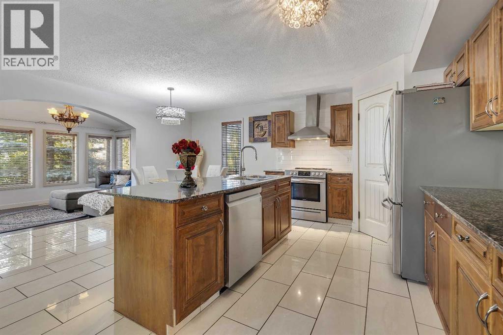 135 Panatella Close Nw, Calgary, AB - Indoor Photo Showing Kitchen With Double Sink