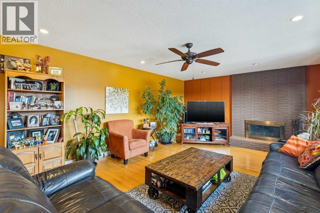 1507 Cayuga Drive Nw, Calgary, AB - Indoor Photo Showing Living Room With Fireplace