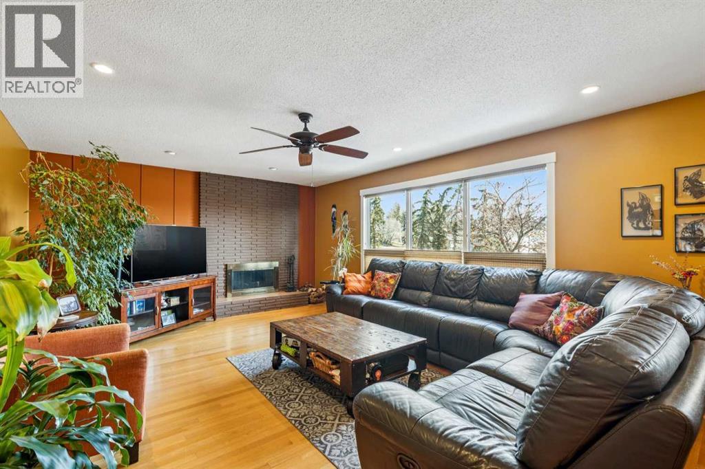 1507 Cayuga Drive Nw, Calgary, AB - Indoor Photo Showing Living Room With Fireplace