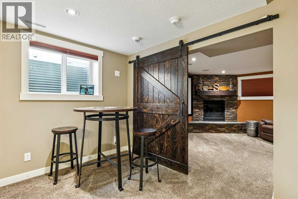 1507 Cayuga Drive Nw, Calgary, AB - Indoor Photo Showing Other Room With Fireplace