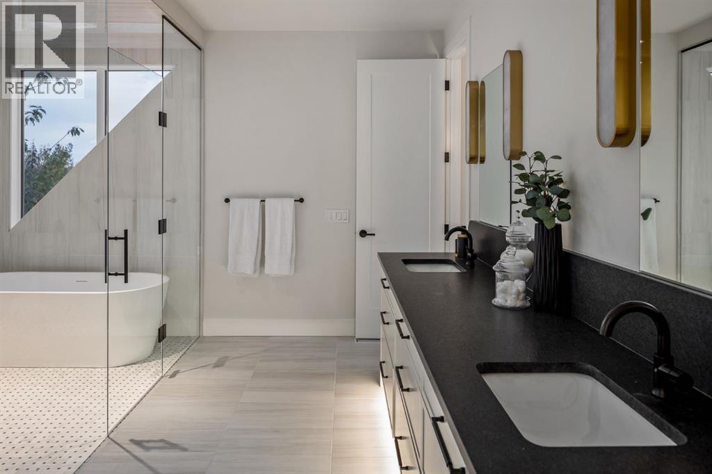 Undermount and Underlit Dual Vanities and Makeup Vanity - 2920 Toronto Crescent Nw, Calgary, AB - Indoor Photo Showing Bathroom