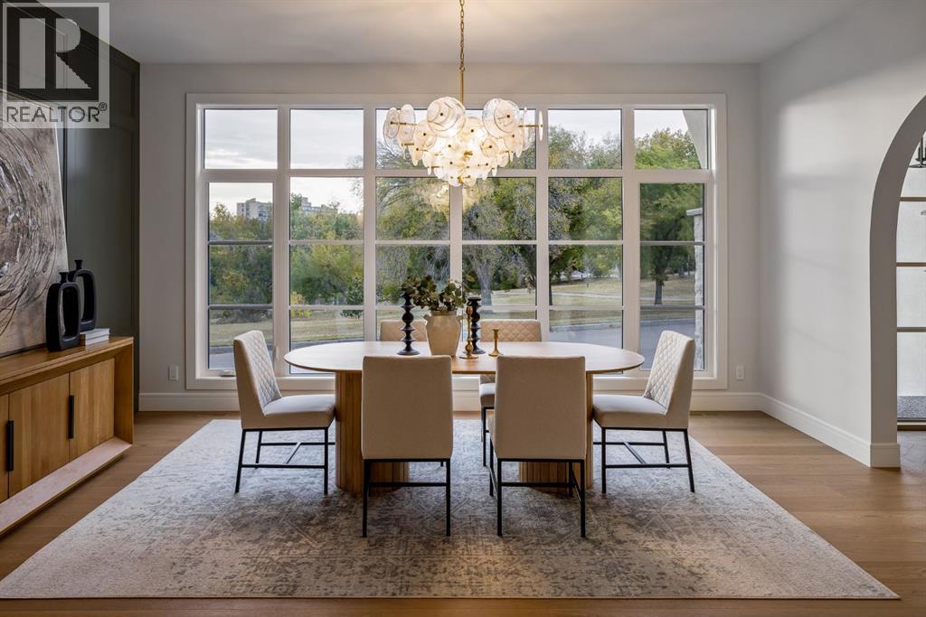 Feature Wall and Designer Light Fixture - 2920 Toronto Crescent Nw, Calgary, AB - Indoor Photo Showing Dining Room