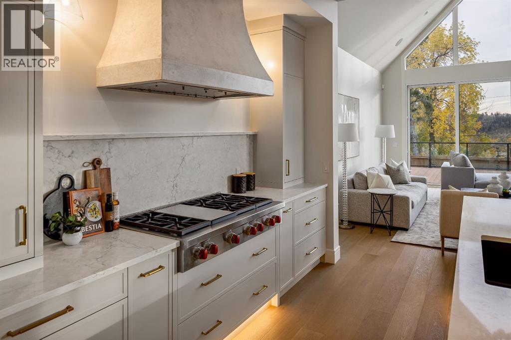 Wolf Gas Cooktop and Microcement Range Hood - 2920 Toronto Crescent Nw, Calgary, AB - Indoor Photo Showing Kitchen With Upgraded Kitchen