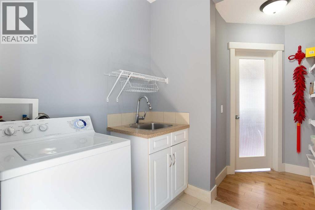 62 Panamount Road Nw, Calgary, AB - Indoor Photo Showing Laundry Room
