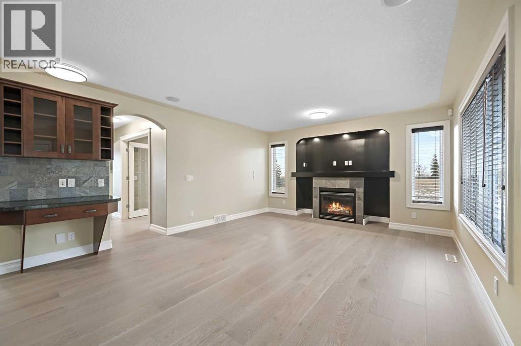 5619 Coach Hill Road Sw, Calgary, AB - Indoor Photo Showing Living Room With Fireplace