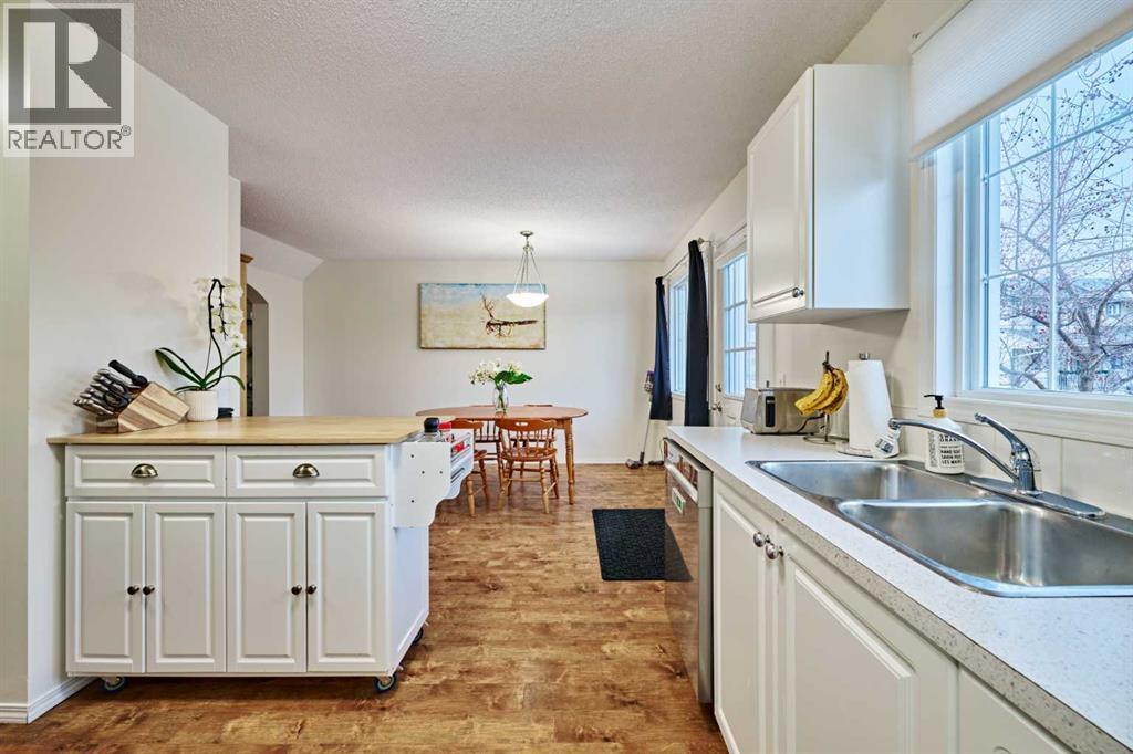 2366 Eversyde Avenue Sw, Calgary, AB - Indoor Photo Showing Kitchen With Double Sink