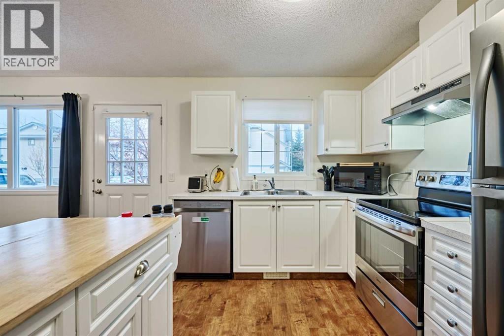 2366 Eversyde Avenue Sw, Calgary, AB - Indoor Photo Showing Kitchen With Double Sink